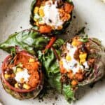 A plate of 50 easy gluten-free dinners featuring stuffed cabbages with sour cream and Swiss chard.
