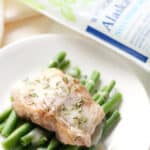 A plate with fish and green beans on it, perfect for a quick and healthy dinner option.