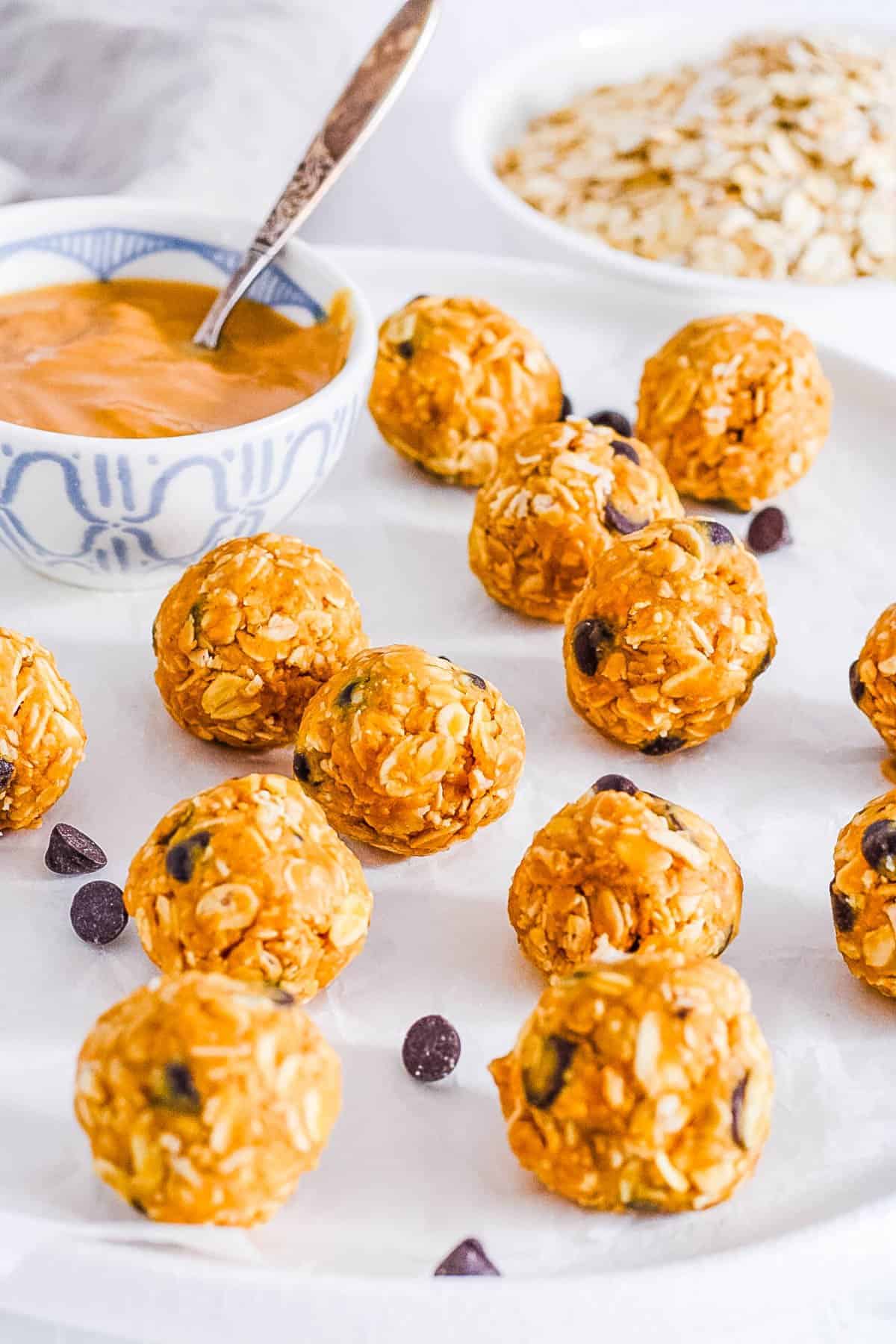 An easy and gluten-free plate of oat bites served with a side of peanut butter.