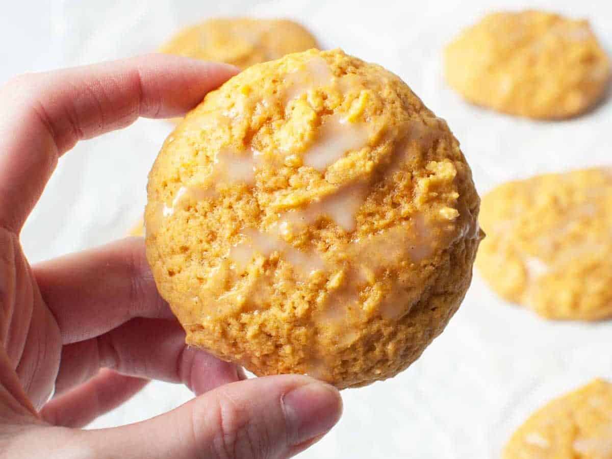 Pumpkin cookie with a hand.
