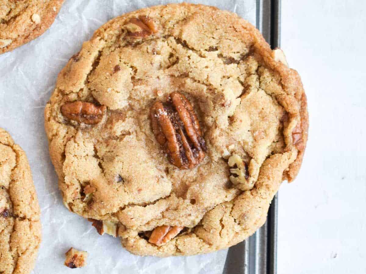 Brown butter cookie with pecans on top.