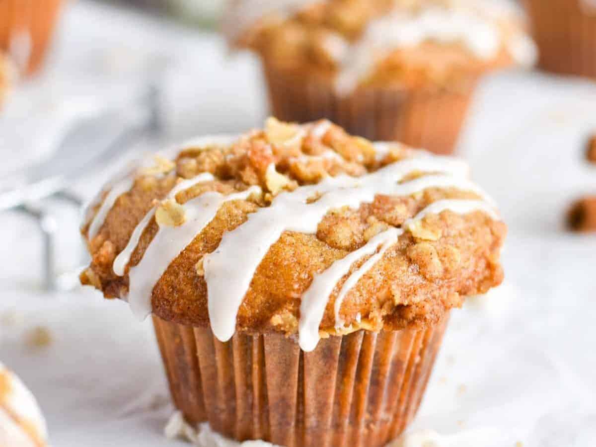One pumpkin muffin with drizzle on top.