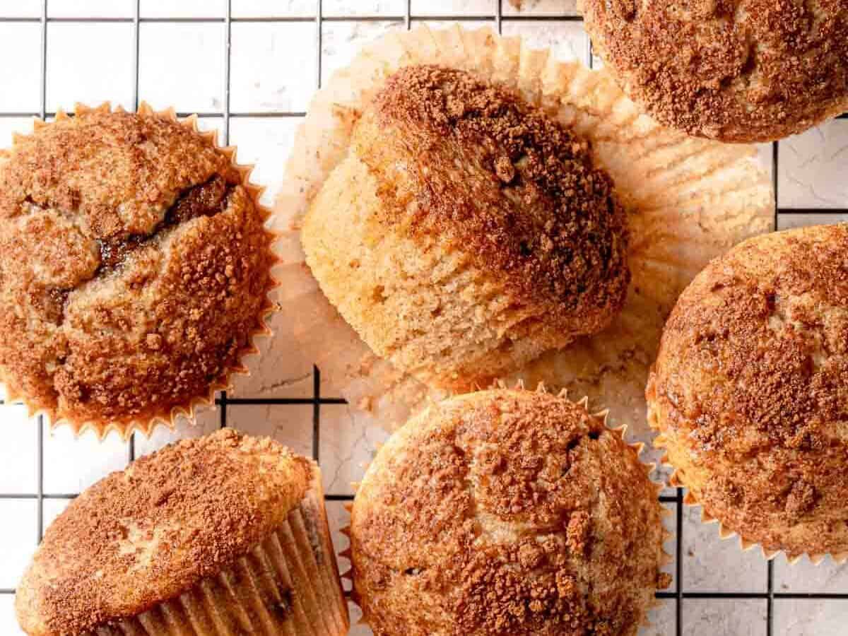 Cinnamon muffins with one on its side.