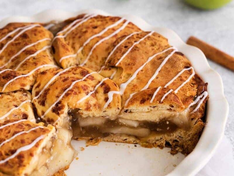 Cinnamon roll pie with white glaze on top.