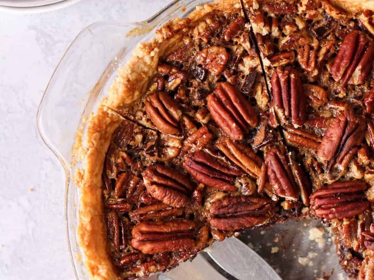 Pecan pie with pecans arranged on top.