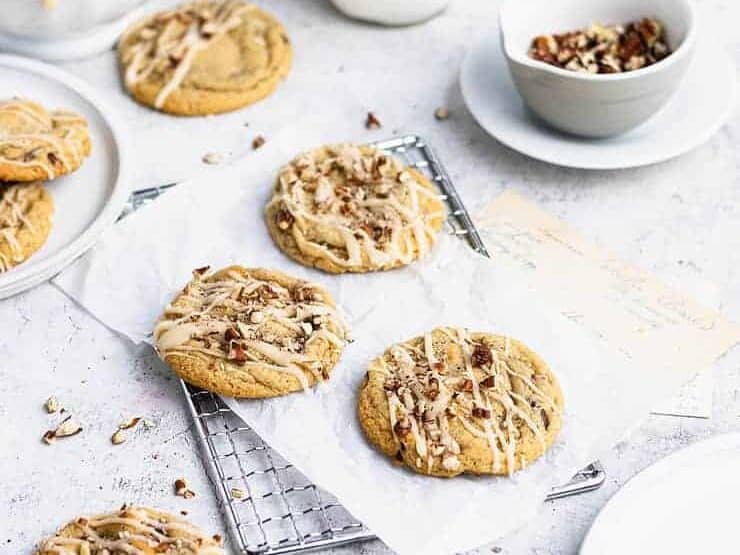 Three pecan cookies on cooling rack.