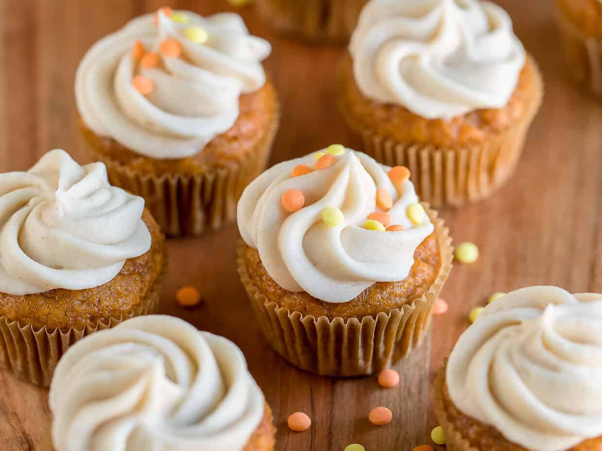 Mini pumpkin cupcakes with confetti.