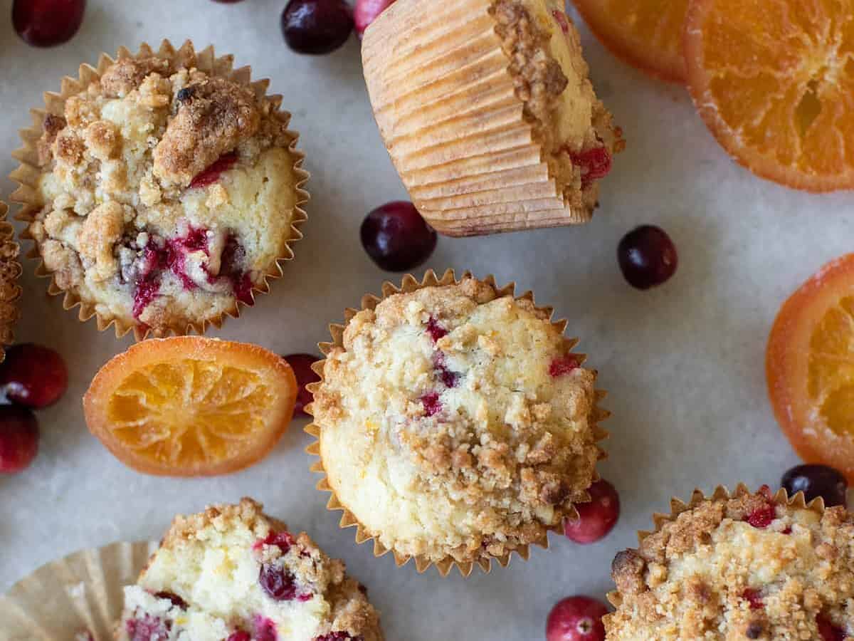 Cranberry muffins on parchment paper.