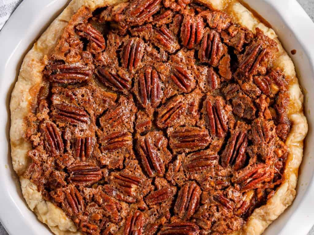 Pecan pumpkin pie with lots of pecans.