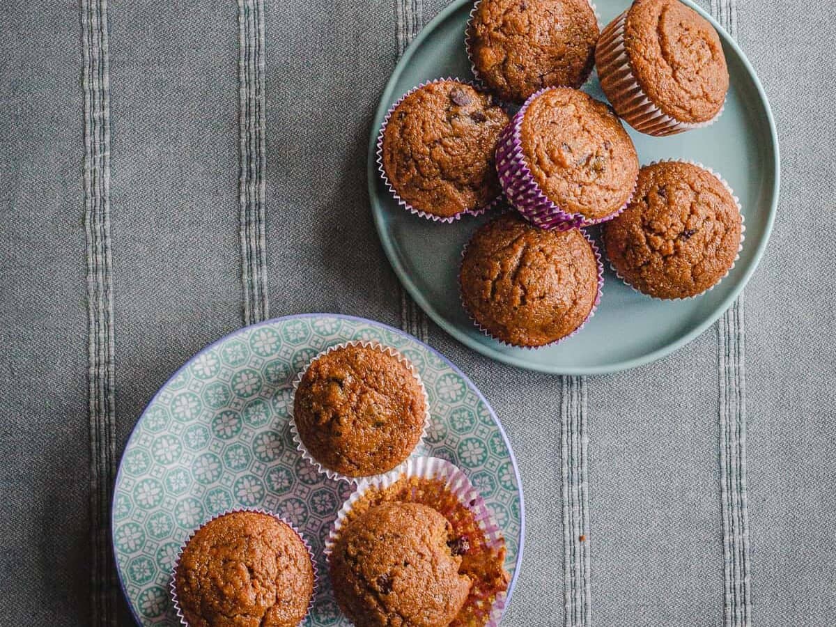 Two blue plates with pumpkin muffins.
