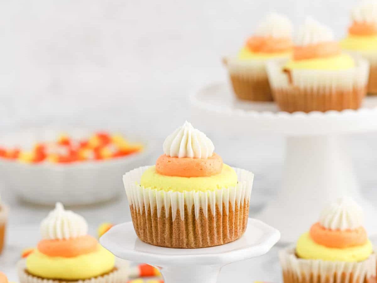 Pumpkin cupcakes with candy corn colors.