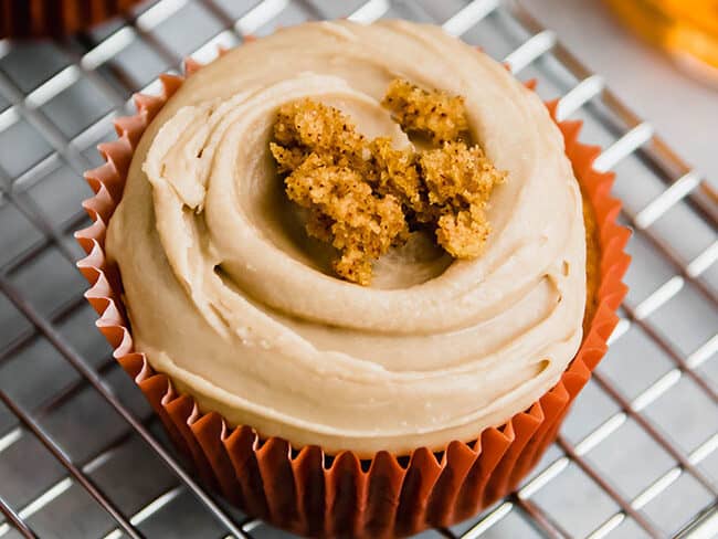 Pumpkin cupcake with topping.