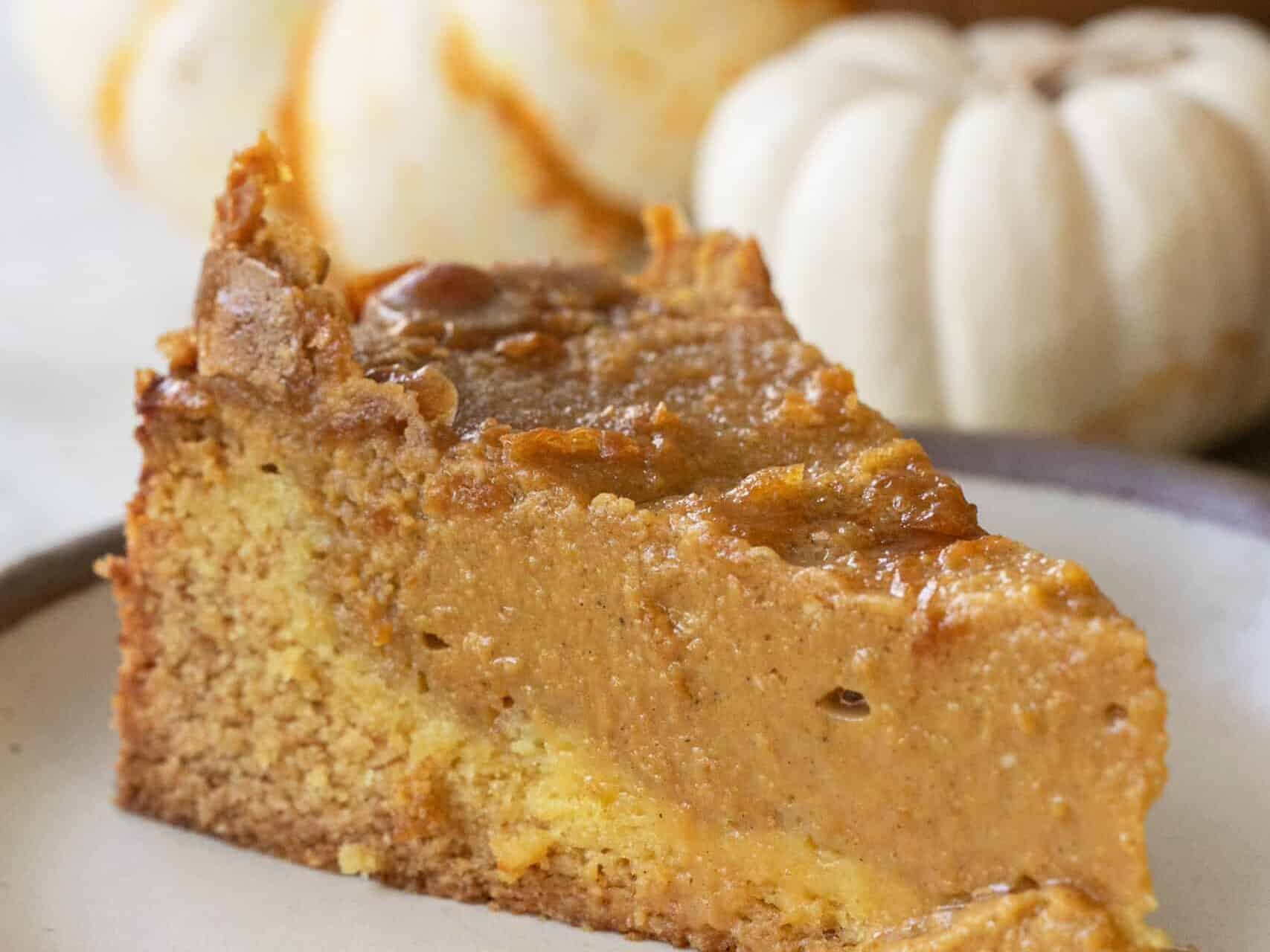 Slice of pumpkin pie on a plate. 