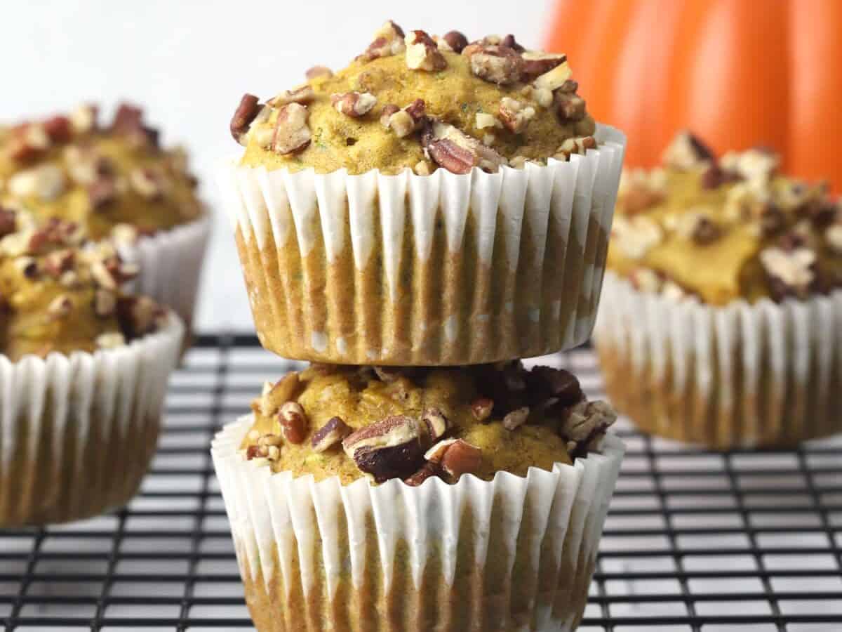 Two pumpkin muffins stacked up.