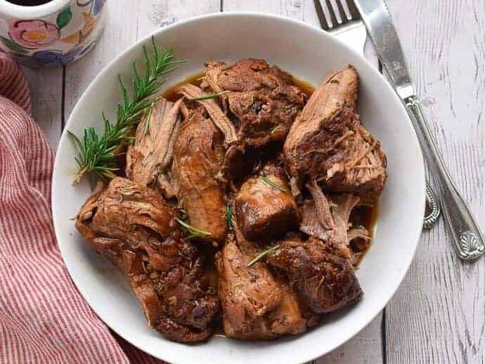 Instant Pot pork tenderloin in a white bowl.