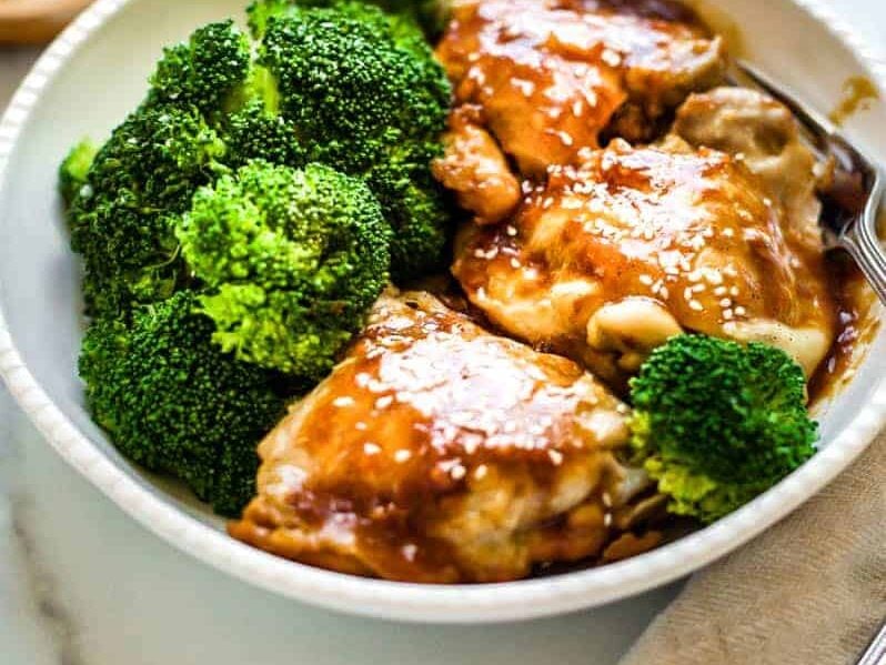 Instant Pot Chicken Teriyaki with broccoli in a white bowl.