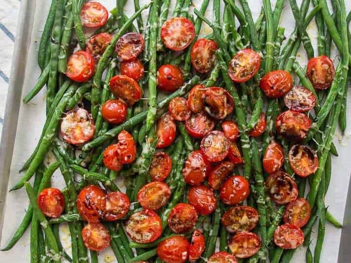 Balsamic Roasted Green Beans And Cherry Tomatoes on a sheet pan.