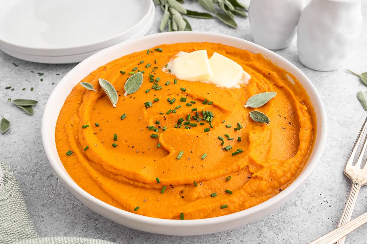 Best Creamy Whipped Sweet Potatoes With Butter on a round bowl. 
