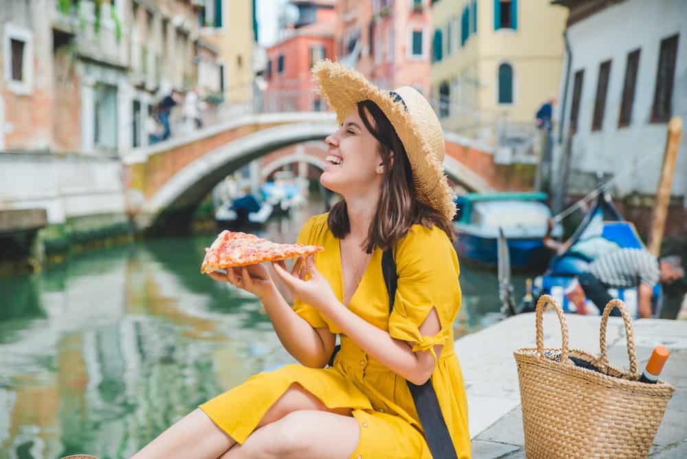 eating pizza in italy