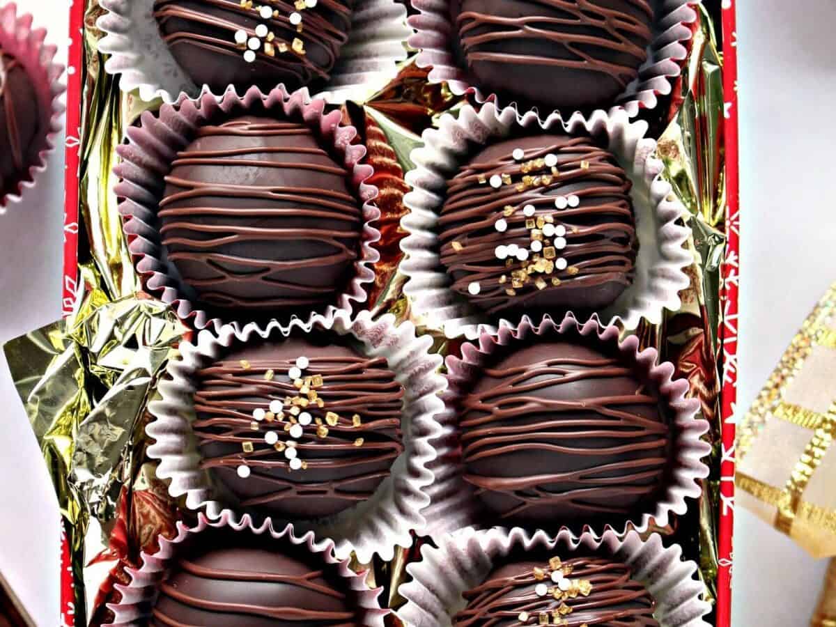 Chocolate covered truffles in a red box.