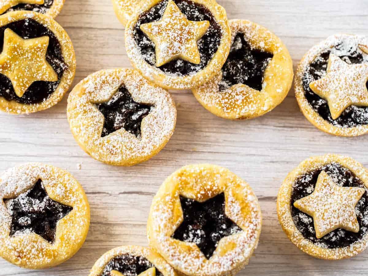 Star shaped mulled wine pies on a wooden table.