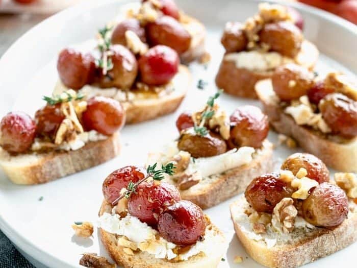 Crostini with grapes on top.