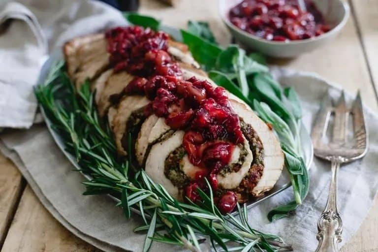 Tart Cherry Chestnut Stuffed Turkey Roulade and topped with cranberry sauce. 