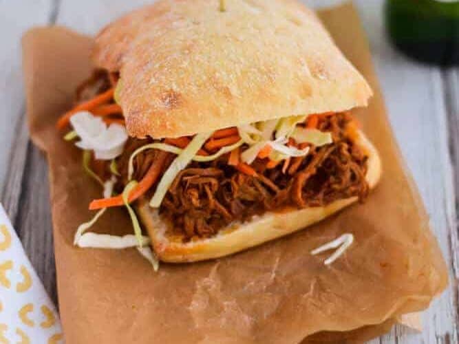 Slow Cooker Barbecue Pork in a sandwich paper.