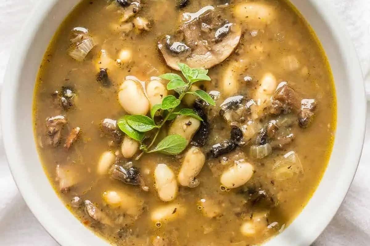 Mushroom bean soup in a white bowl. 