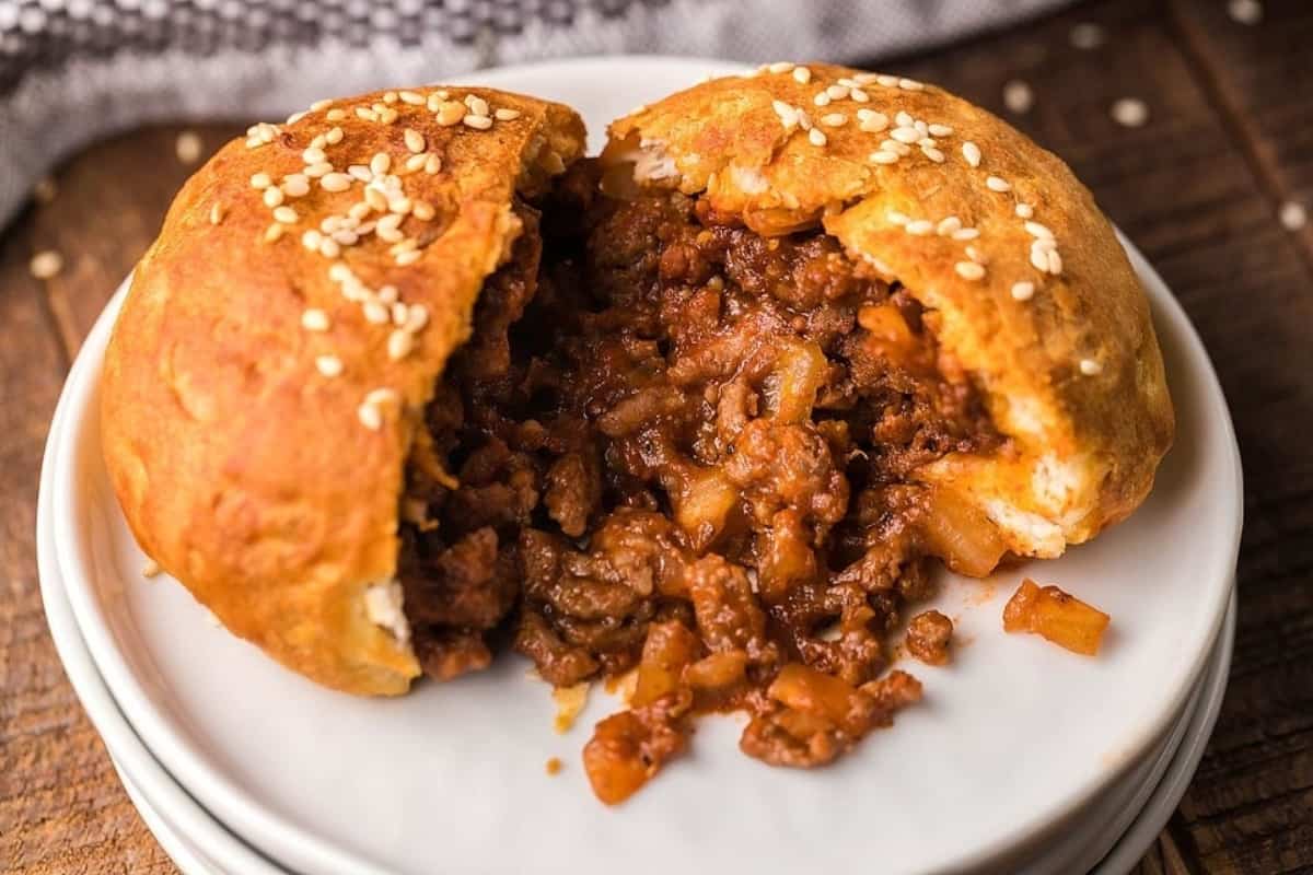 Sliced sloppy joes on a plate.