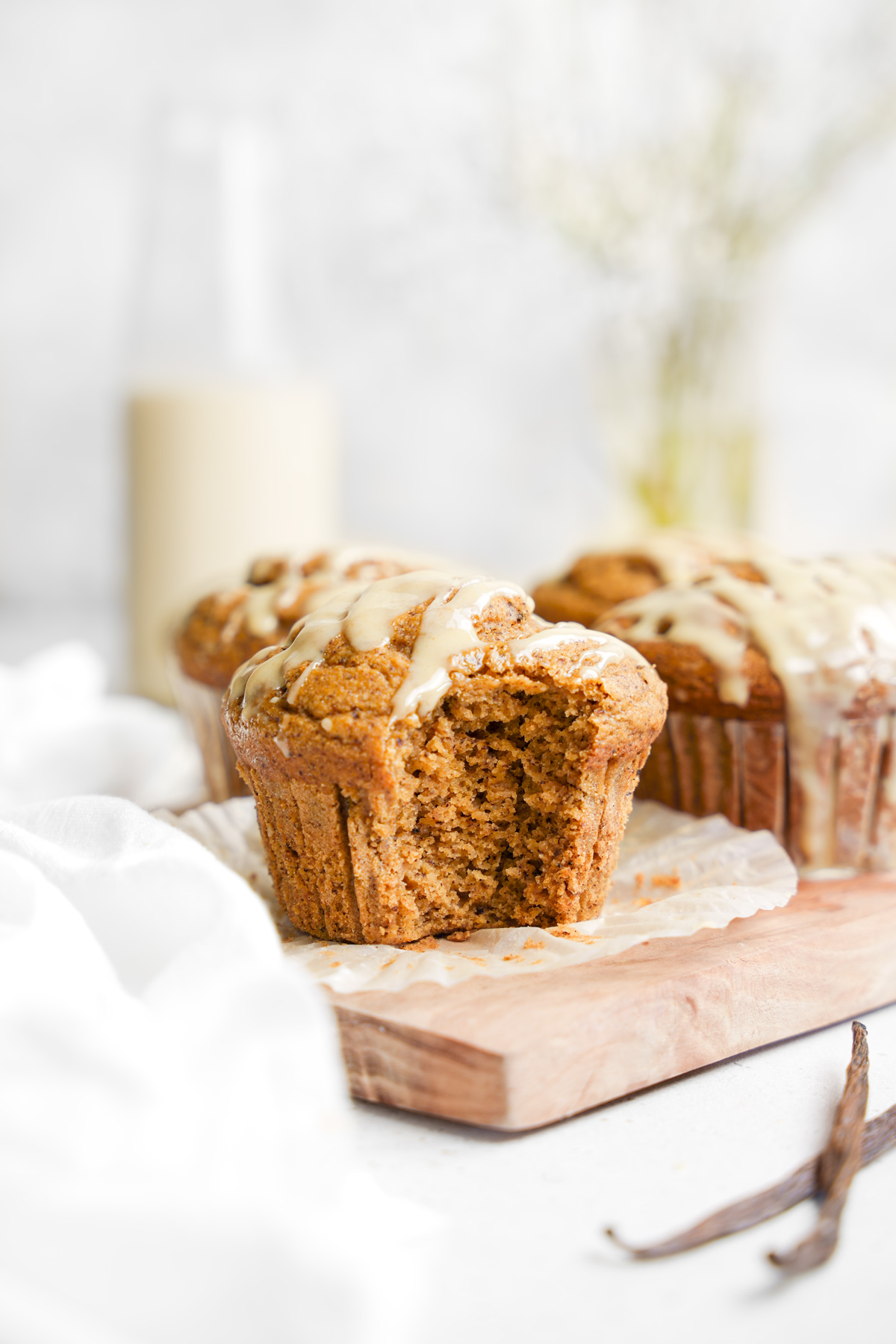Bakery Style Gluten-Free Vanilla Muffins served on a wooden board.