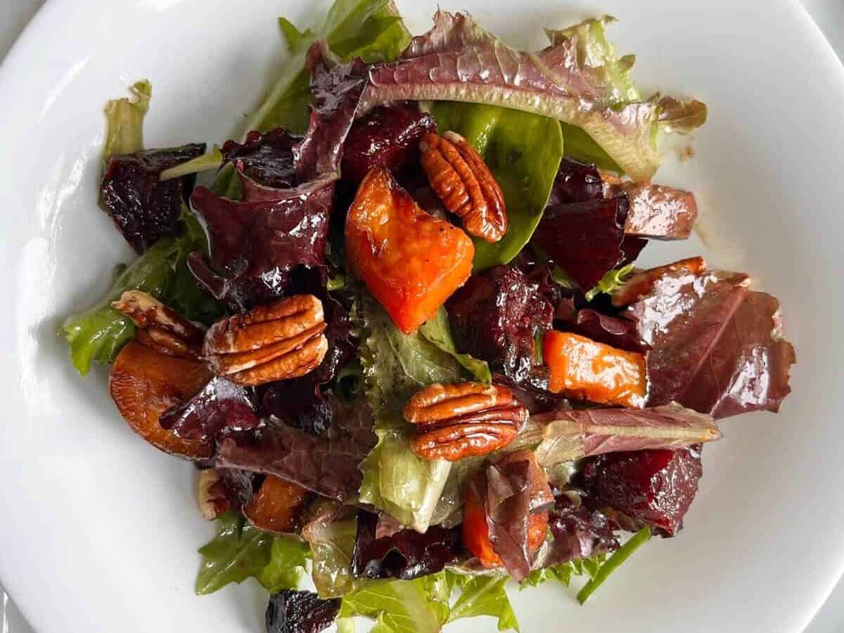 Beetroot And Sweet Potato Salad on a round plate.