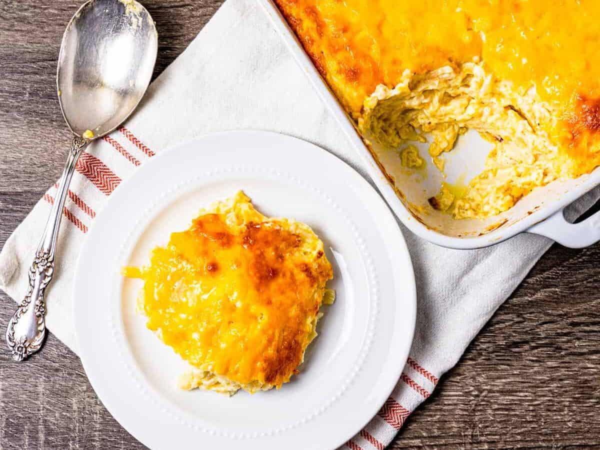 A serving of Cheesy Hashbrown Casserole on a plate. 