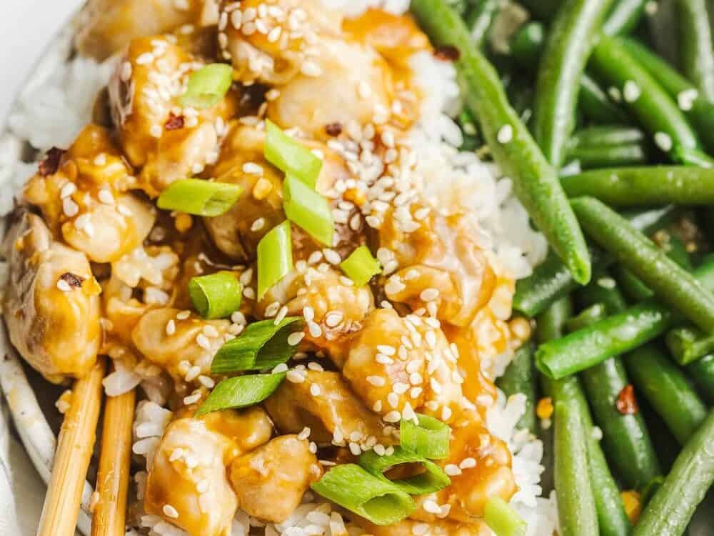 Chicken stir-fried in teriyaki sauce with sesame seeds over top.