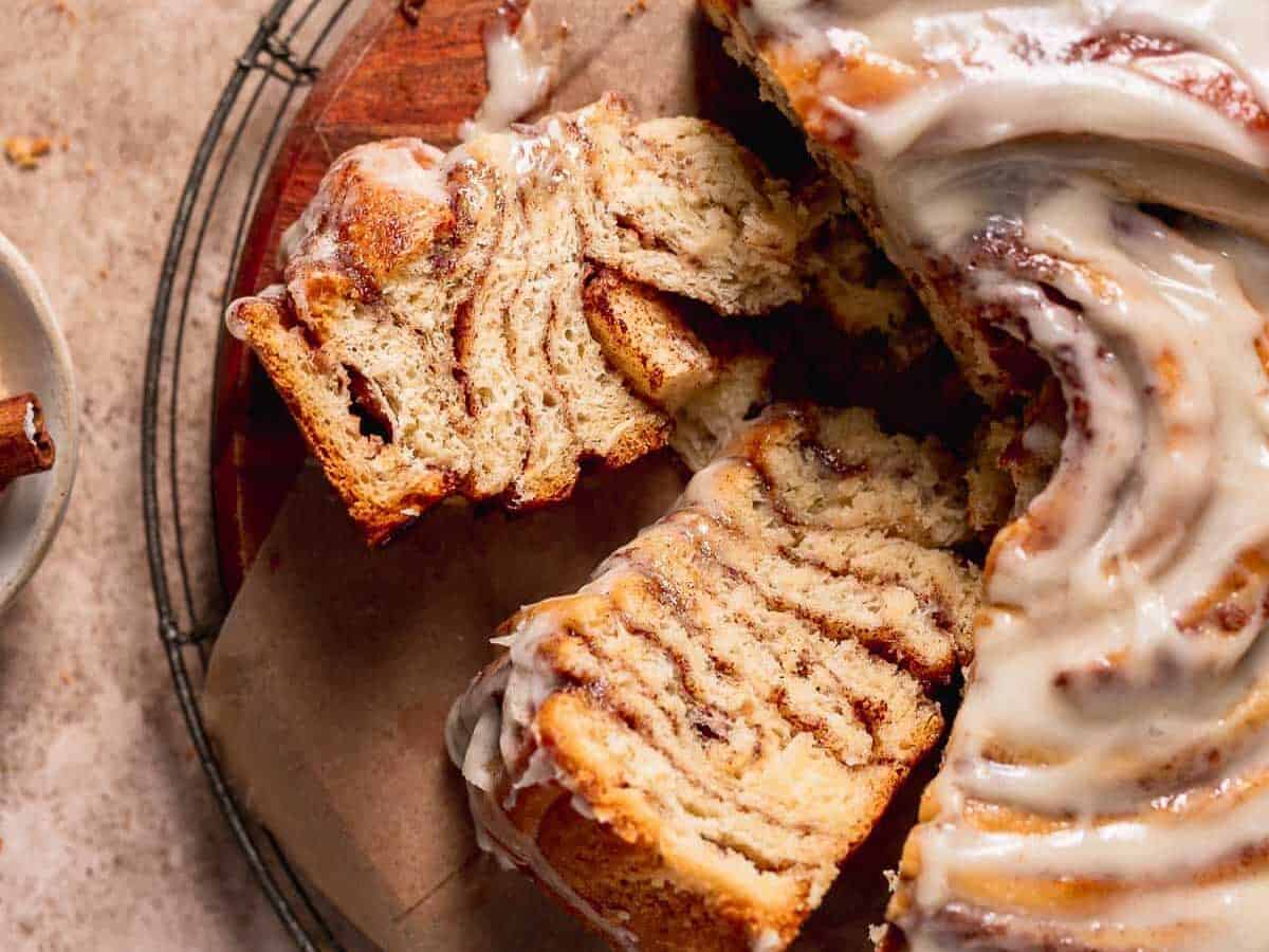 Whole Cinnamon Roll Cake with slices. 