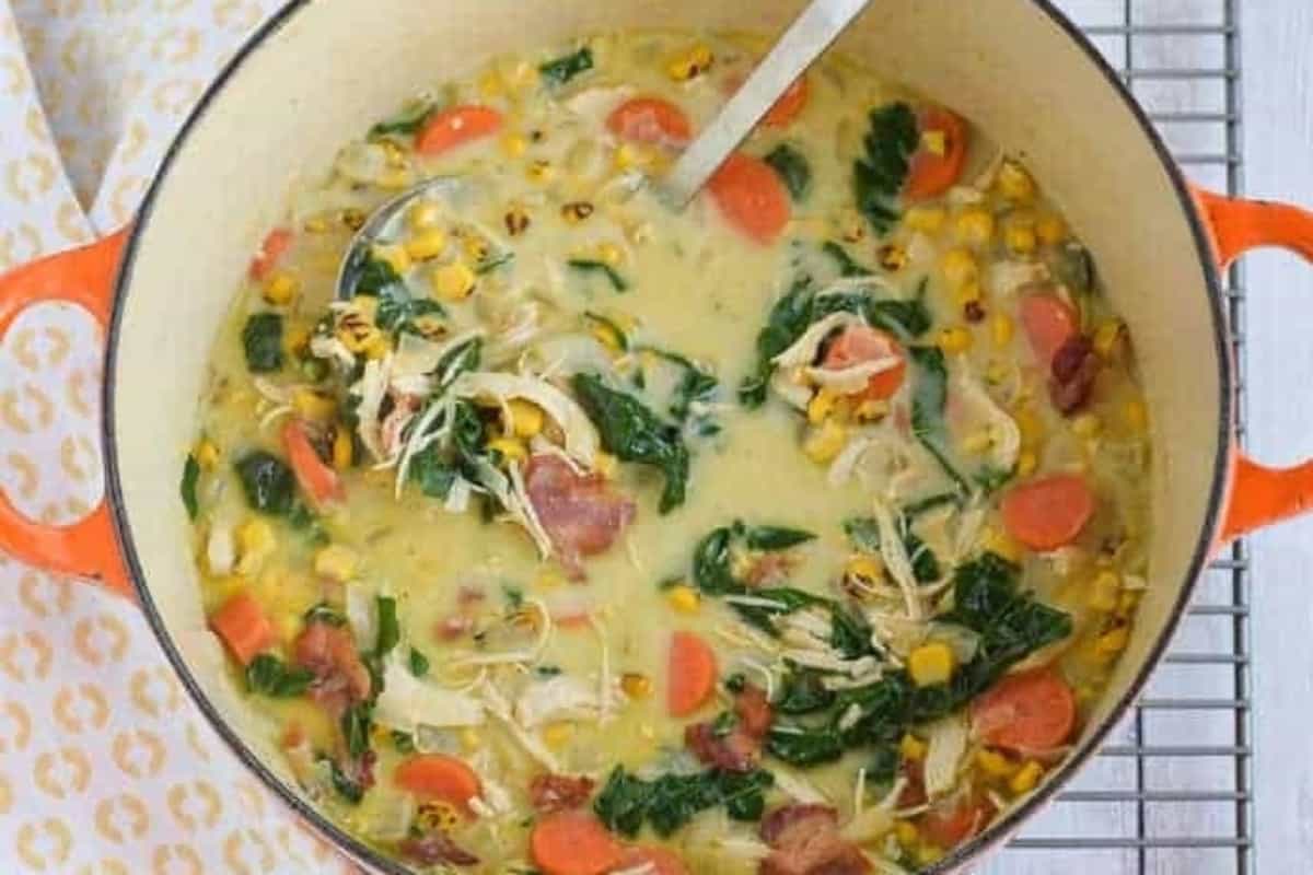 Creamy chicken soup with corn and veggies, with bacon over the top. 