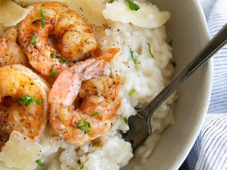 A bowl of risotto with shrimp and parmesan.