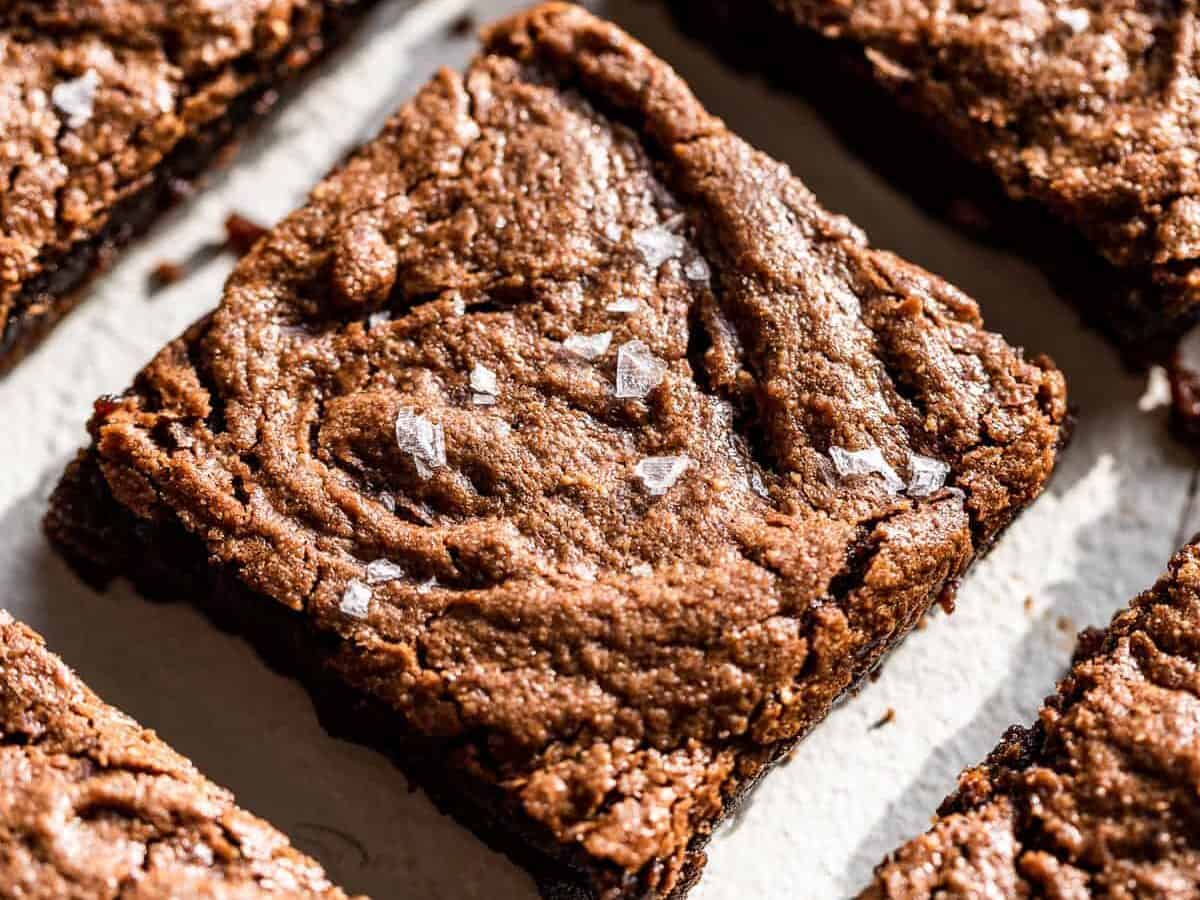 Slices of flourless brownies and topped with sea salt.