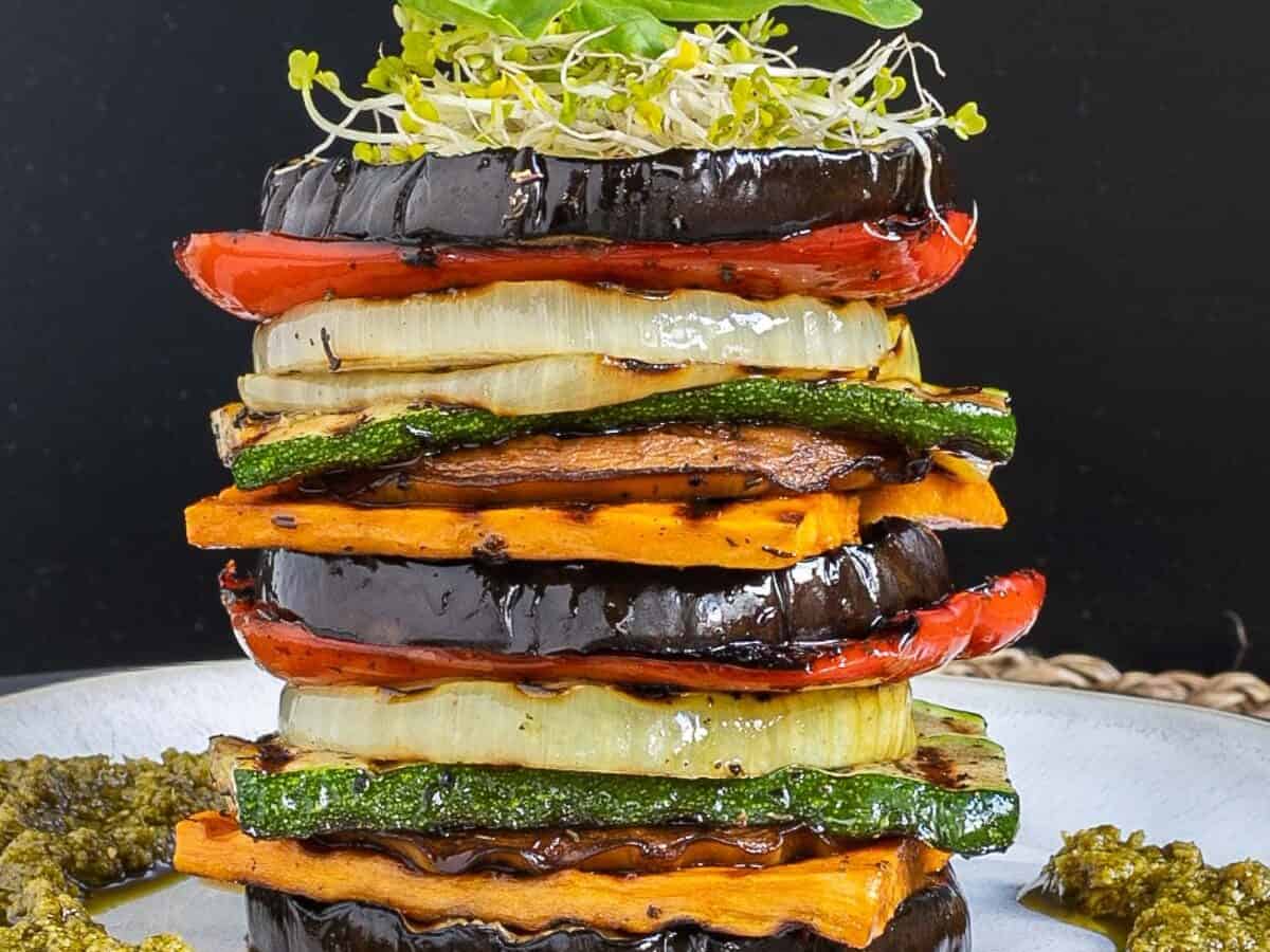 Stacked sliced vegetables of all colors.