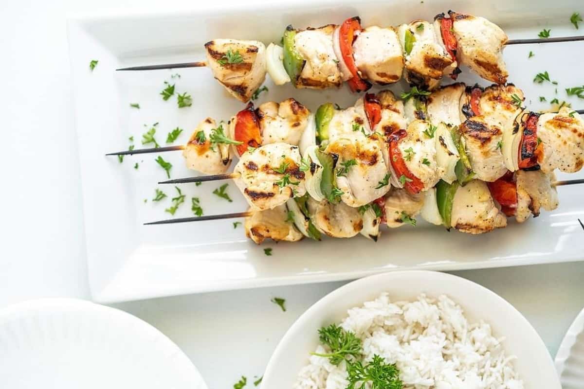 Chicken kebabs on a plate.