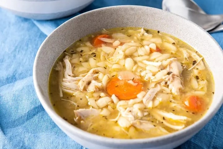 Chicken soup in a bowl.