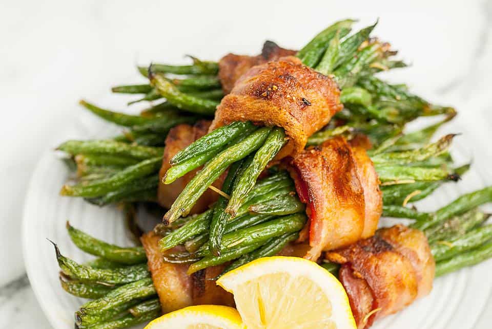 Bundles of green beans wrapped in bacon.