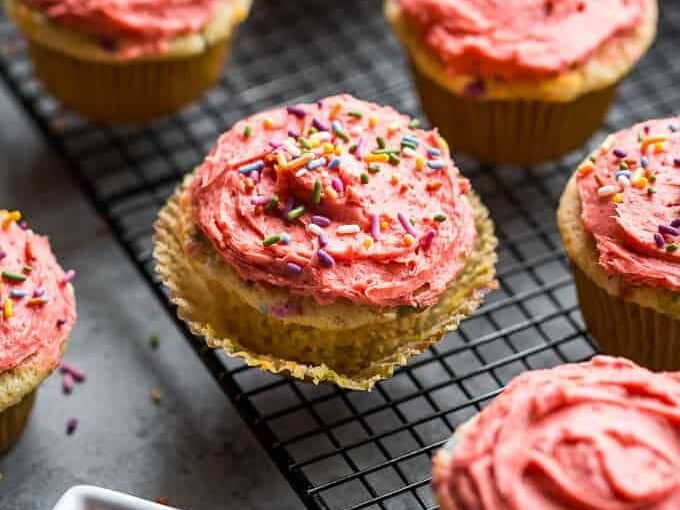 Natural Funfetti Cupcakes with Strawberry Buttercream with pink buttercream and sprinkles.