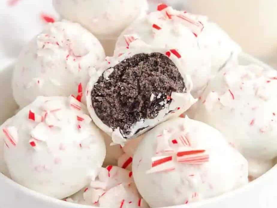 Peppermint Oreo balls in a white bowl. 