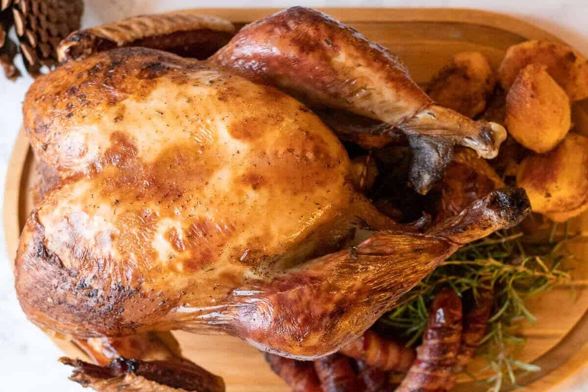 Whole roasted turkey served on a dish. 