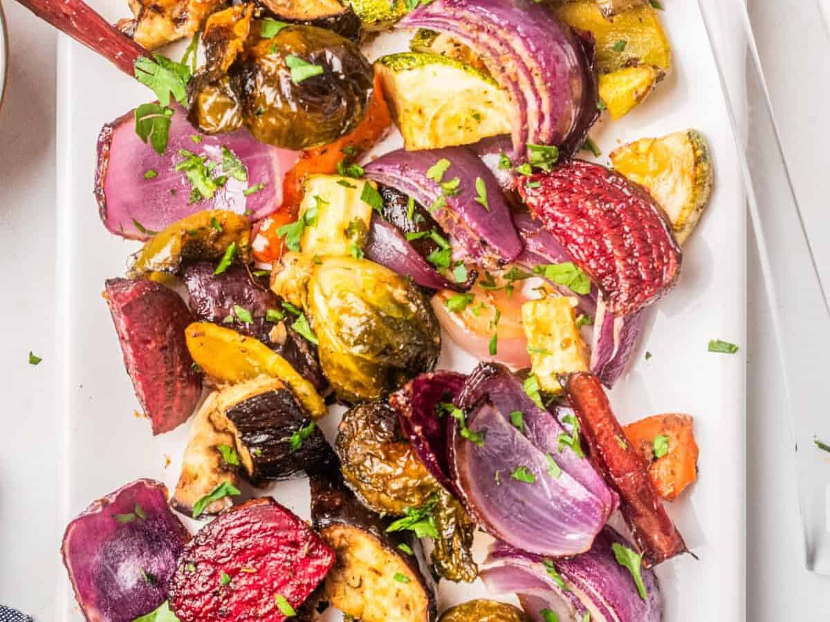 Roasted vegetables mixed together on a plate.