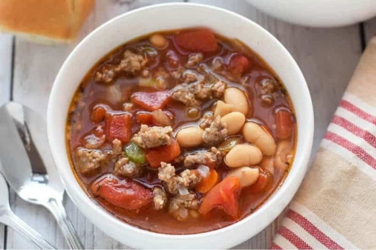 Sausage and bean soup in a bowl.