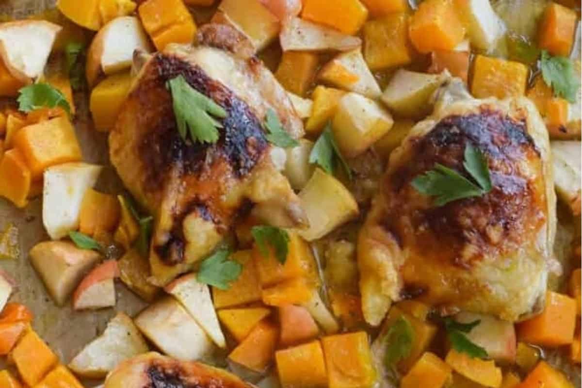 Chicken with squash on a tray.