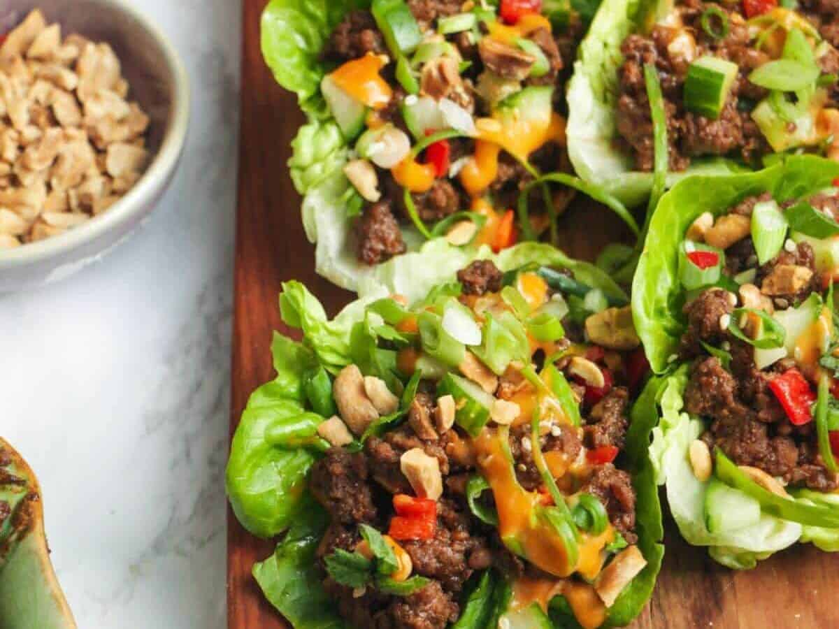 Korean beef on lettuce wraps with sauce.