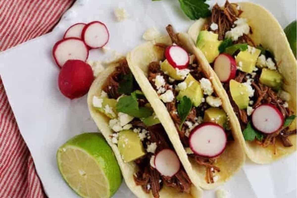 Beef brisket tacos on a plate.